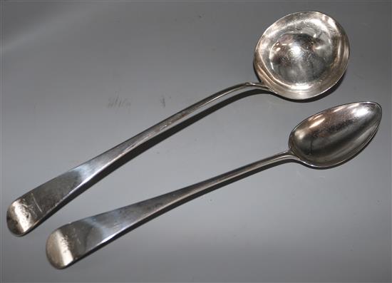 A George III silver soup ladle and similar basting spoon.